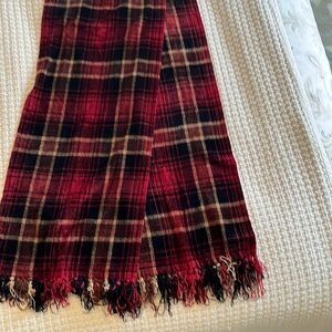 Long red, black and tan plaid scarf with fringe.